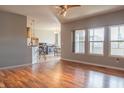 Open-concept living room featuring hardwood floors and a seamless flow into the kitchen and dining area at 14461 Brook Meadow Dr, McCordsville, IN 46055