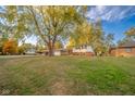 Well-maintained single-Gathering home with lush greenery and mature trees at 1718 Charles St, Anderson, IN 46013