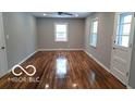 Bright living room with hardwood floors, neutral walls, and a minimalist design at 3121 W 13Th St, Anderson, IN 46011