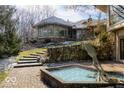 An elegant water feature with a unique sculpture amidst the brickwork and landscaped garden at 5400 W Deer Run Ct, Muncie, IN 47304
