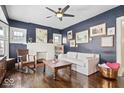 Inviting living room features hardwood floors, a decorative fireplace, and a comfortable white sofa at 737 N Riley Ave, Indianapolis, IN 46201