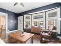Well-lit living room with beautiful hardwood floors and a comfortable sitting area at 737 N Riley Ave, Indianapolis, IN 46201