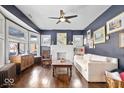 Bright living room with natural light, hardwood floors, and a decorative fireplace at 737 N Riley Ave, Indianapolis, IN 46201