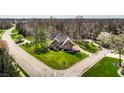 An aerial view of the home showcasing its landscaping and neighborhood at 8845 Otter Cove Cir, Indianapolis, IN 46236