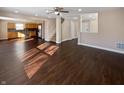 Spacious living room featuring hardwood floors, open layout, and a ceiling fan at 14466 Bramkrist Dr, Fishers, IN 46038