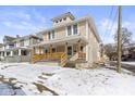 Traditional two-story home with a covered front porch and classic design at 19 Parkview Ave, Indianapolis, IN 46201
