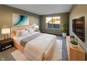 A beautifully staged bedroom with a large window and modern decor creates a relaxing atmosphere at 5251 Rocky Mountain Dr, Indianapolis, IN 46237