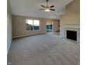 Spacious living room features a fireplace, open layout, and sliding glass doors to the backyard at 5251 Rocky Mountain Dr, Indianapolis, IN 46237