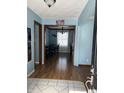 Inviting entryway with hardwood floors leading to a bright dining area at 720 Mount Rainier Dr, Indianapolis, IN 46217