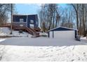 View of the backyard with a detached two car garage at 815 Woodhill Dr, Indianapolis, IN 46227