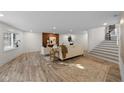 Bright living room with lots of natural light, modern decor, and staircase at 815 Woodhill Dr, Indianapolis, IN 46227