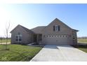 Attractive single-story brick home with a well-maintained lawn and an inviting driveway entrance at 10502 Oak Bend Blvd, Indianapolis, IN 46239