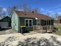 Well-kept single-Gathering home with a detached garage and tidy front yard at 1235 Indiana Ave, Anderson, IN 46012