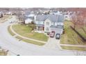 Beautifully landscaped home with well-manicured lawn and convenient two-car garage nestled in quiet residential neighborhood at 1501 Willshire Dr, Greenwood, IN 46143