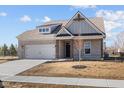 Attractive single-Gathering house featuring brick facade, manicured lawn, and an attached two-car garage at 5040 Carmine St, Brownsburg, IN 46112
