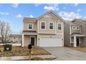 Attractive two-story home with a two-car garage and classic architectural details, set in a new community at 5119 Rolling Meadow Blvd, Indianapolis, IN 46237