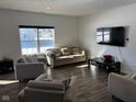 Comfortable living room with modern furniture, a large window, and a wall-mounted TV at 5120 Maywood Dr, Whitestown, IN 46075
