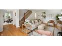 Cozy living room with hardwood floors and neutral-toned furniture and decor at 6865 Meadow View Dr, Lawrence, IN 46226