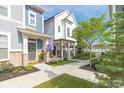 Charming townhomes featuring inviting front porches and meticulously landscaped surroundings, creating a welcoming ambiance at 9208 Hawley Dr, Indianapolis, IN 46216