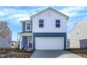 Charming two-story home with blue siding and a white garage door, offering a modern and inviting curb appeal at 11711 Cotterill Way, Indianapolis, IN 46235
