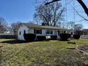 Attractive ranch home featuring a charming swing, manicured bushes, and a well-maintained front lawn at 143 Sawmill Rd, Whiteland, IN 46184