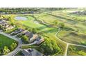 Expansive aerial view of a lot with lush greenery, nestled in a neighborhood near a golf course and serene lakes at 16473 Valhalla Dr, Noblesville, IN 46060