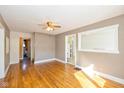 Inviting dining area with hardwood floors, a ceiling fan, and ample space for Gathering gatherings and entertaining guests at 189 S St Clair St, Martinsville, IN 46151