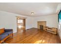 Bright living room featuring hardwood floors, a cozy fireplace, and an open layout perfect for entertaining and relaxing at 189 S St Clair St, Martinsville, IN 46151