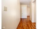 Inviting hallway showcasing gleaming hardwood floors and neutral wall tones at 2566 S Ritter Ave, Indianapolis, IN 46203
