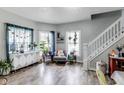 Inviting living room boasts hardwood floors, lots of natural light and charming decor at 2962 Station St, Indianapolis, IN 46218