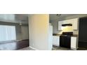 Kitchen featuring a gas range oven, white cabinets, and gray walls at 3527 N Wittfield St, Indianapolis, IN 46235