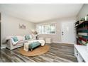 Bright living room features stylish decor and hardwood floors at 3549 Woodale Rd, Indianapolis, IN 46234