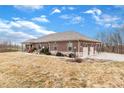 A sprawling brick home featuring an attached two-car garage and well-maintained landscaping at 3764 S 475 W, Trafalgar, IN 46181