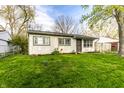 Cozy one-story house with a well-kept green lawn and inviting curb appeal at 3944 Strathmore Dr, Indianapolis, IN 46235