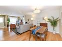Comfortable living and dining area with hardwood floors and natural light at 4501 N Wheeling Ave # 10A-101, Muncie, IN 47304