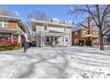 Classic two-story home with a welcoming porch and manicured front yard in a friendly neighborhood at 4805 N Park Ave, Indianapolis, IN 46205