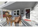 Inviting front porch with comfortable seating, perfect for relaxing and enjoying the neighborhood view at 4805 N Park Ave, Indianapolis, IN 46205