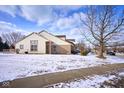 Well-kept home featuring a back deck, a large yard, and a serene, snow-covered neighborhood at 4912 Eagle Talon Ct, Indianapolis, IN 46254