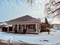 Well-maintained home featuring a welcoming front porch and updated exterior finishes at 609 Powell St, Lebanon, IN 46052