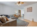 Comfortable living room featuring a plush sectional sofa, neutral walls, and wood-look flooring for a cozy feel at 61 North Dr, Mooresville, IN 46158