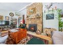 Cozy living room with a floor-to-ceiling stone fireplace as a striking focal point at 7166 N Oak Ridge Rd, Morgantown, IN 46160
