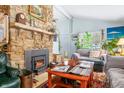 Bright living room with an efficient fireplace and access to additional rooms at 7166 N Oak Ridge Rd, Morgantown, IN 46160