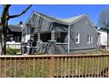 Quaint gray house shows off its clean design and well maintained fence at 1046 Nelson Ave, Indianapolis, IN 46203