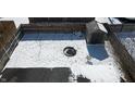 Aerial view of a spacious backyard with a firepit, storage shed, and a privacy fence covered in fresh snow at 10885 Walnut Grove Bnd, Camby, IN 46113