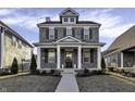 Charming two-story brick home with a welcoming front porch and manicured lawn at 1538 Cloverdon Dr, Westfield, IN 46074