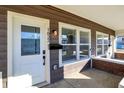 Inviting front porch with modern accents, offering a glimpse of the home's stylish facade at 1624 Prospect St, Indianapolis, IN 46203