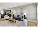 Inviting living room seamlessly blending with a modern kitchen, creating an open and airy space at 1624 Prospect St, Indianapolis, IN 46203