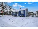 Attractive front yard, displaying the blue home and enhancing curb appeal at 1651 Lawton Ave, Indianapolis, IN 46203