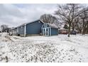 Backyard with a utility shed, chain link fence, and trees during the winter season at 2758 S Lyons Ave, Indianapolis, IN 46241