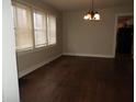 Inviting dining room features hardwood floors and a classic chandelier at 3160 Graceland Ave, Indianapolis, IN 46208
